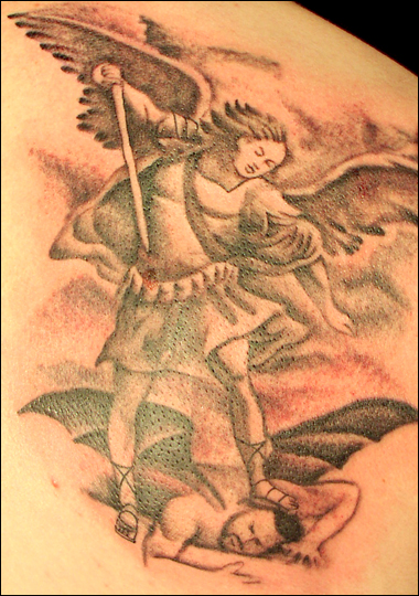 angel devil tattoo angel holding baby tattoo. angel devil tattoo