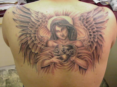 praying angel tattoo. Angel tattoos are believed to