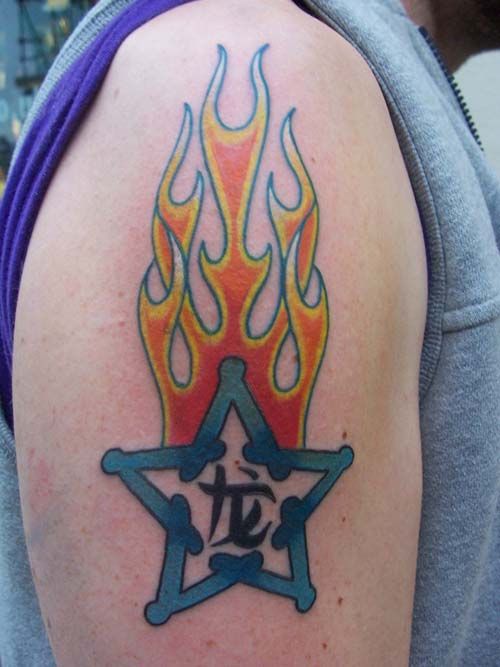 star tattoo flamming star tattoo